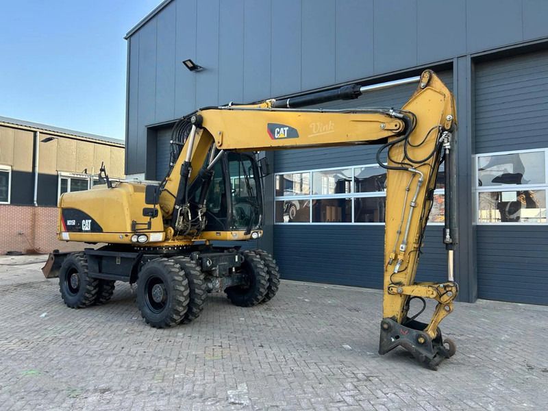 2011 Caterpillar M315D wheel excavator, side profile view