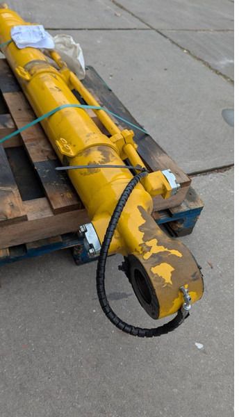2022 Komatsu PC210LC-10 bucket cylinder, close-up view