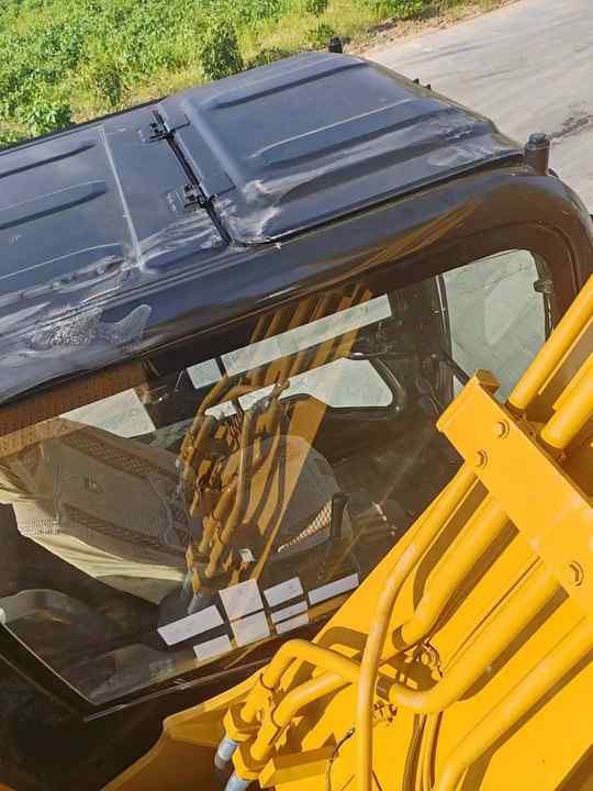 Caterpillar 315D Crawler Excavator cab roof and boom view Caterpillar 315D Crawler Excavator cab roof and boom view