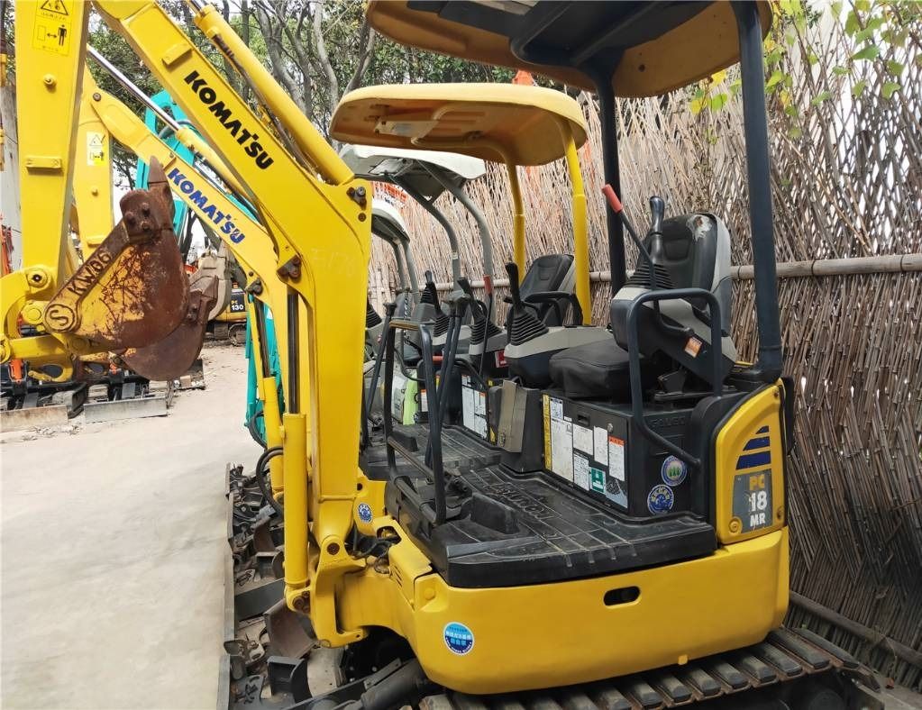 2023 Komatsu PC18MR-3 mini excavator, side view of open operator station 2023 Komatsu PC18MR-3 mini excavator, side view of open operator station