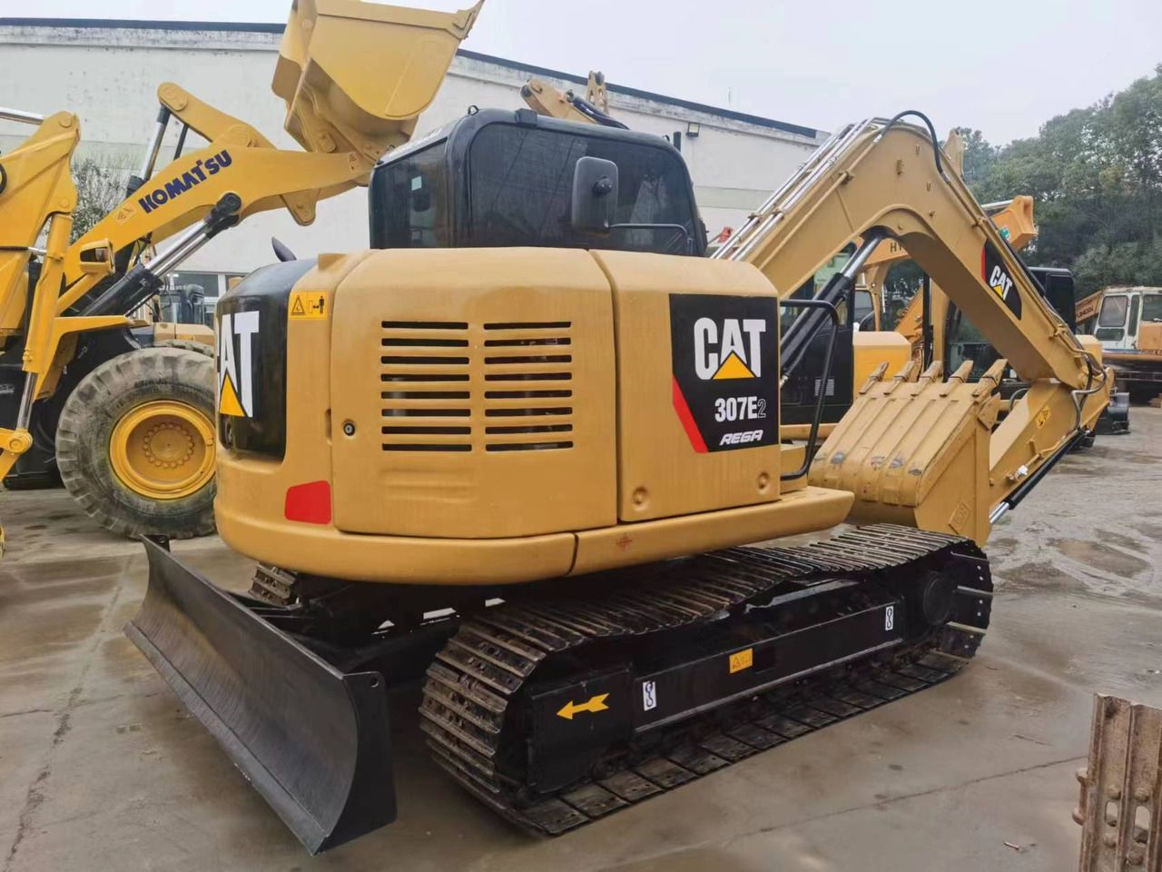 2018 Caterpillar 307E2 mini excavator rear three-quarter view 2018 Caterpillar 307E2 mini excavator rear three-quarter view