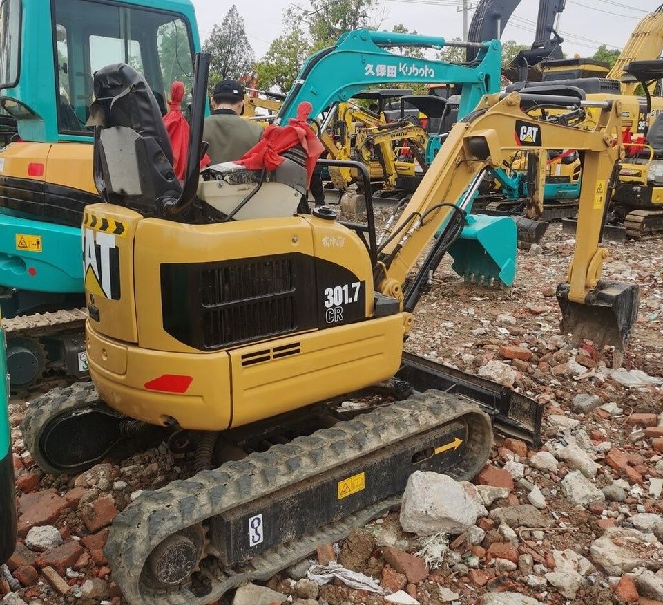 Caterpillar 301.7 CR mini excavator, rear three-quarter view Caterpillar 301.7 CR mini excavator, rear three-quarter view