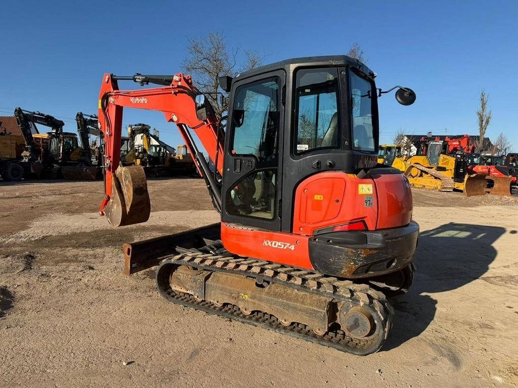 2019 Kubota KX057-4 mini excavator, front three-quarter view 2019 Kubota KX057-4 mini excavator, front three-quarter view