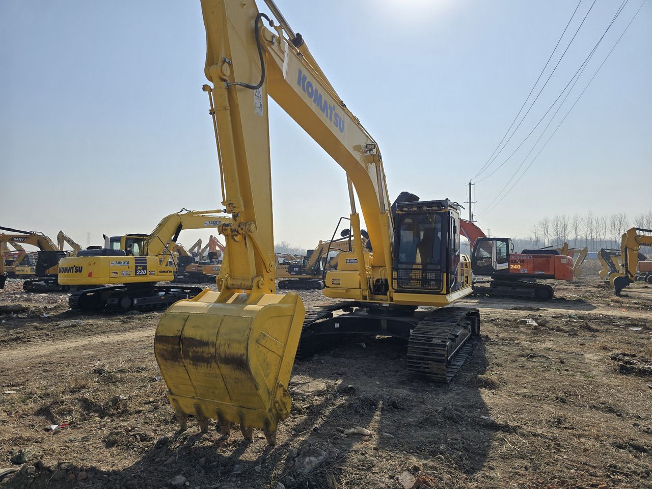 2025 Komatsu PC240-8 crawler excavator, front three-quarter view