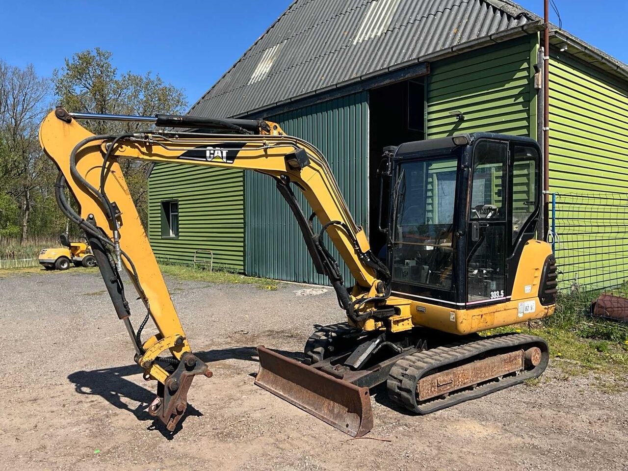 Caterpillar 303.5 mini excavator, side view Caterpillar 303.5 mini excavator, side view