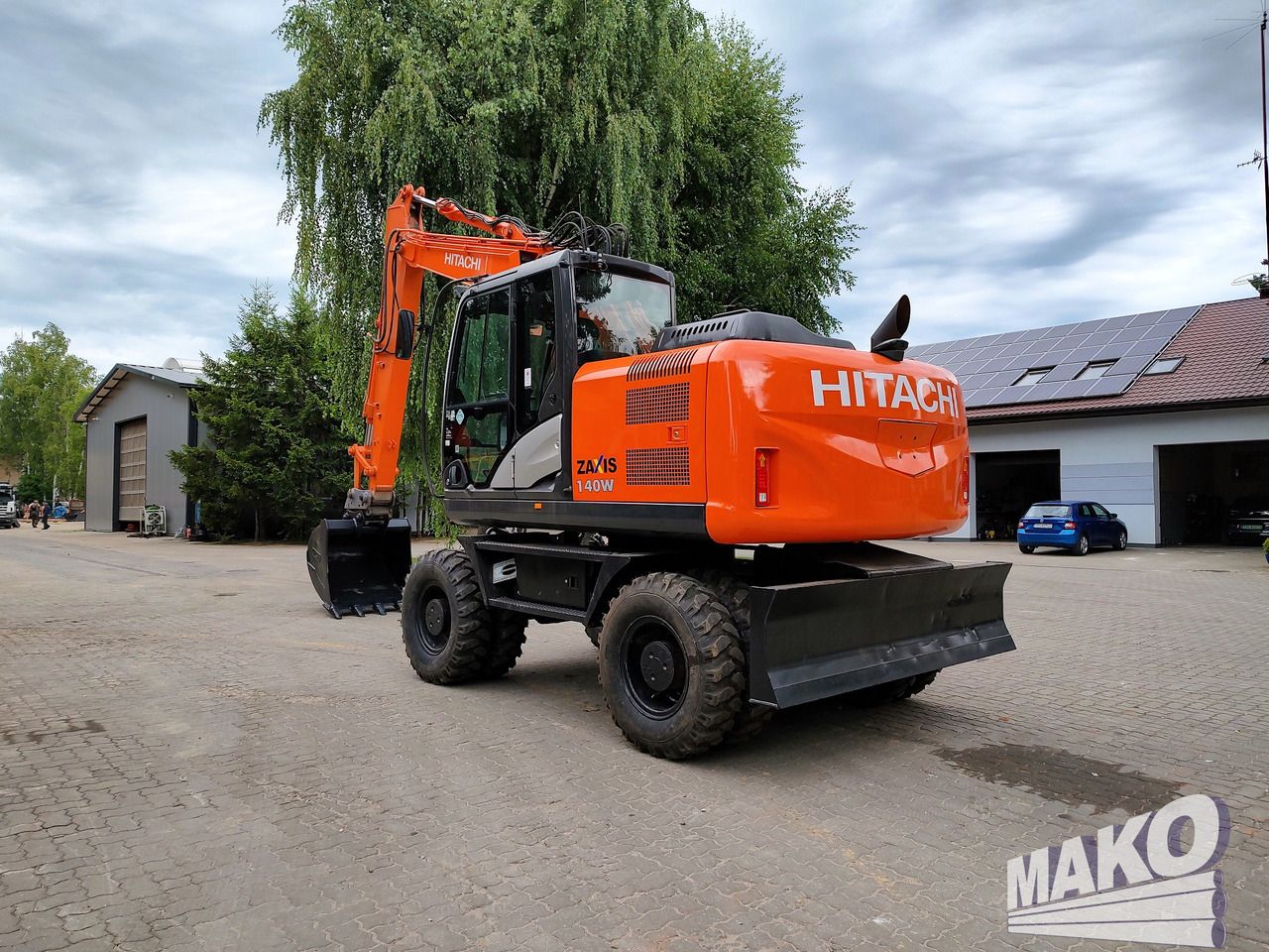 2016 Hitachi Zaxis 140W wheel excavator, rear three-quarter view