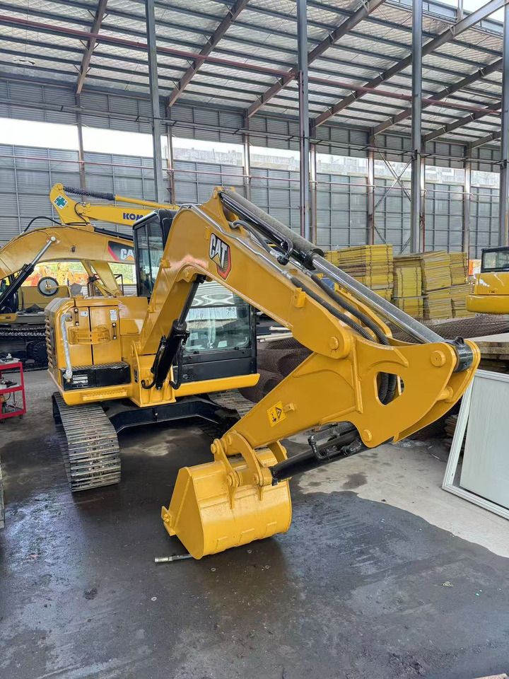 2024 Caterpillar 305.5E2 mini excavator, front three-quarter view