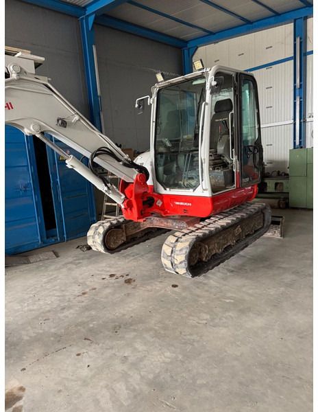 2016 Takeuchi TB260 mini excavator, side view