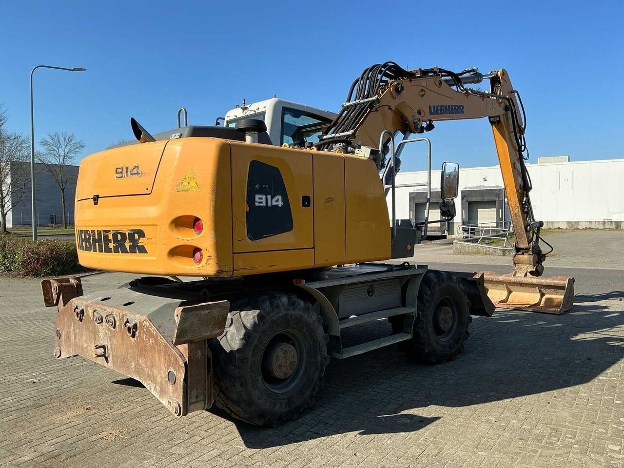 2017 Liebherr 914 wheel excavator, rear three-quarter view 2017 Liebherr 914 wheel excavator, rear three-quarter view