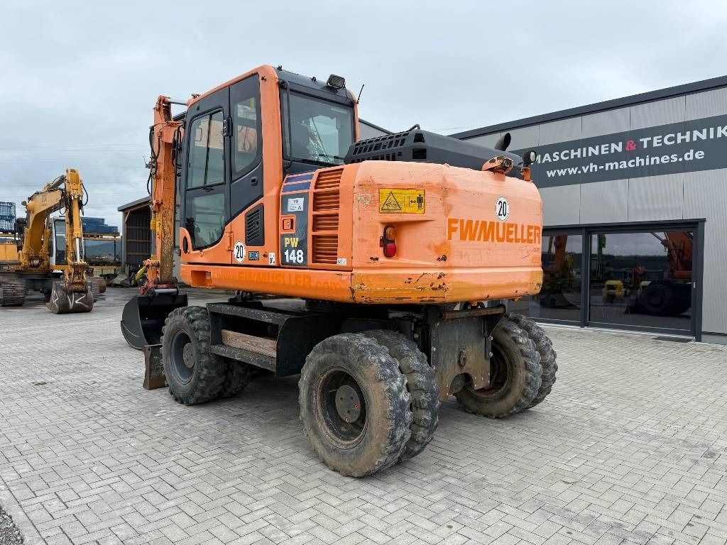 2013 Komatsu PW148-8 wheel excavator, rear three-quarter view