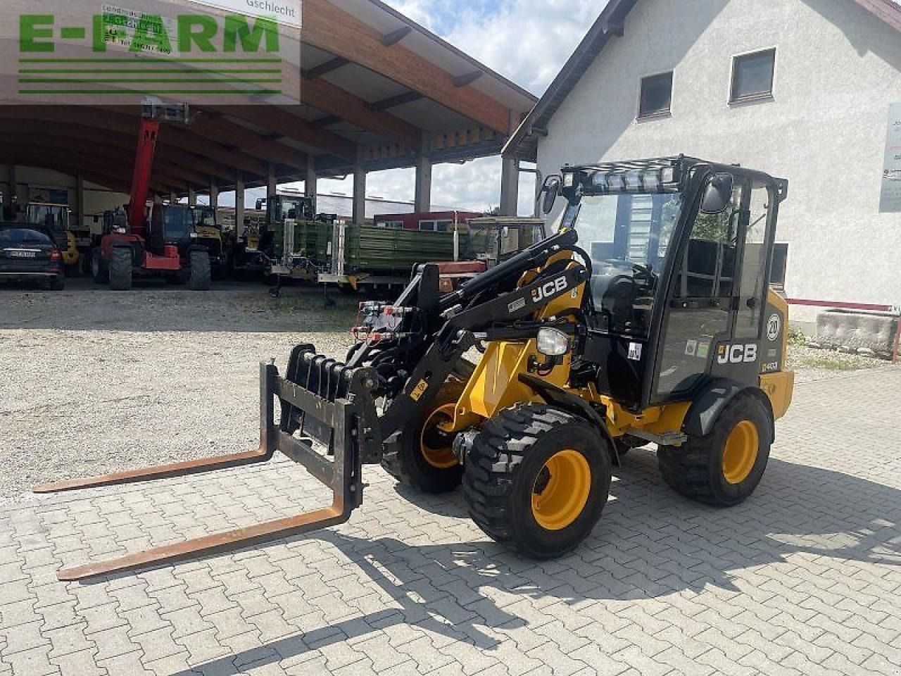 2022 JCB 403 mini excavator with pallet forks, front three-quarter view 2022 JCB 403 mini excavator with pallet forks, front three-quarter view