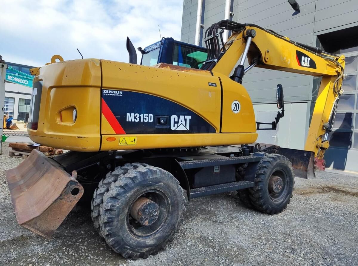2009 Caterpillar M315D wheel excavator, rear three-quarter view