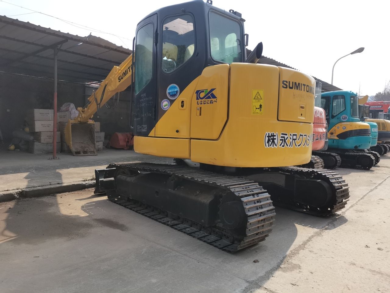 2016 Sumitomo SH75 mini excavator, rear three-quarter view 2016 Sumitomo SH75 mini excavator, rear three-quarter view
