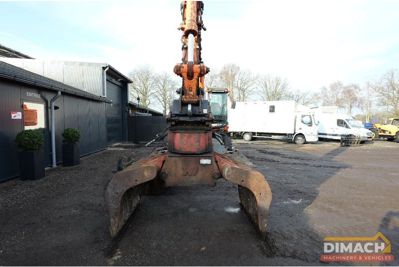1997 Atlas 1704 material handler front view with grab attachment 1997 Atlas 1704 material handler front view with grab attachment