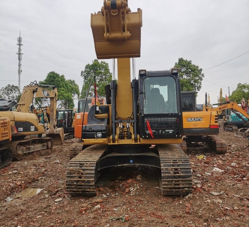 Caterpillar 315D2GC crawler excavator, front view Caterpillar 315D2GC crawler excavator, front view