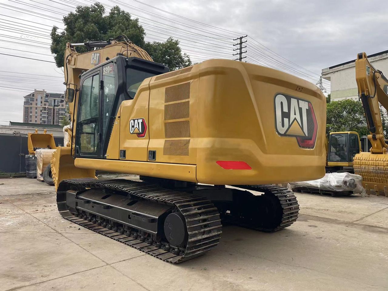 2022 Caterpillar 320GC crawler excavator, rear three-quarter view 2022 Caterpillar 320GC crawler excavator, rear three-quarter view