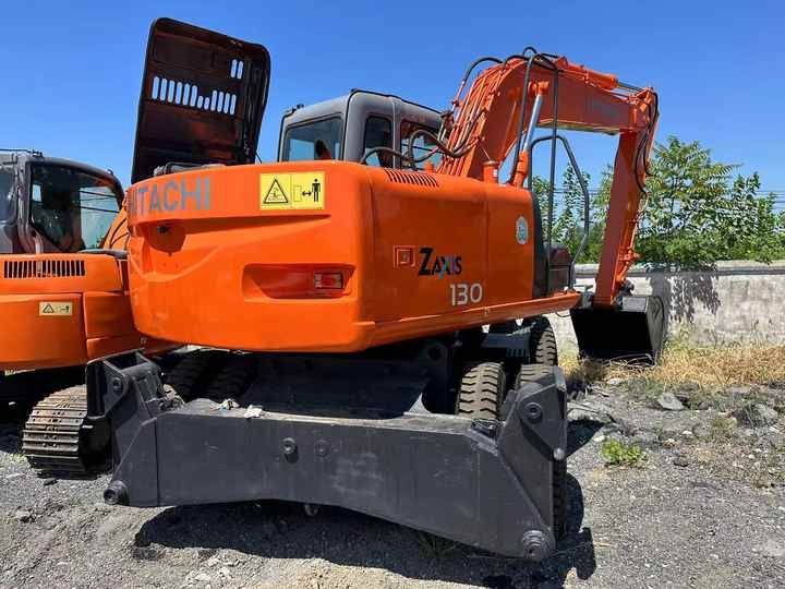 2023 Hitachi Zaxis 130 wheel excavator, rear three-quarter view
