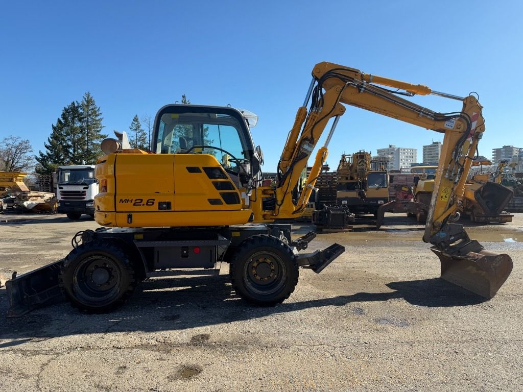 2012 New Holland MH 2.6 wheel excavator, side profile view 2012 New Holland MH 2.6 wheel excavator, side profile view