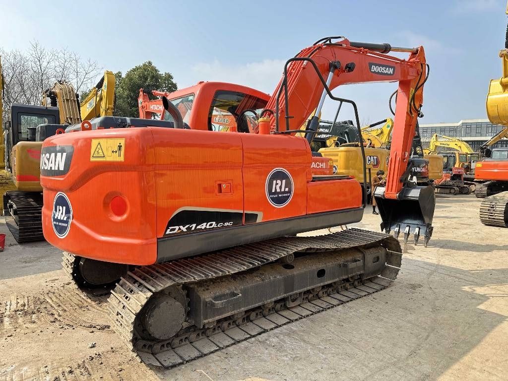 2023 Doosan DX140LC-9C crawler excavator, rear three-quarter view