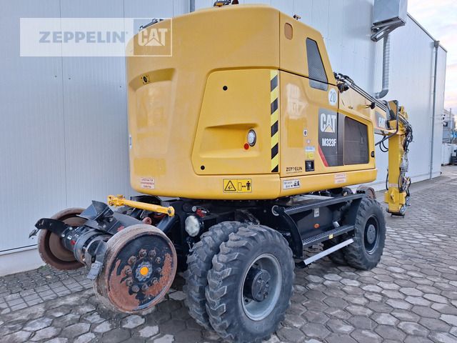 2019 Caterpillar M323F wheel excavator, rear three-quarter view 2019 Caterpillar M323F wheel excavator, rear three-quarter view