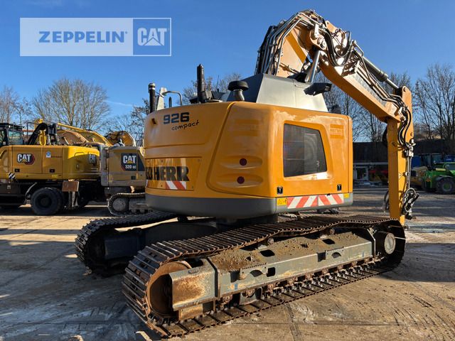 2019 Liebherr R926 Compact crawler excavator, rear three-quarter view 2019 Liebherr R926 Compact crawler excavator, rear three-quarter view