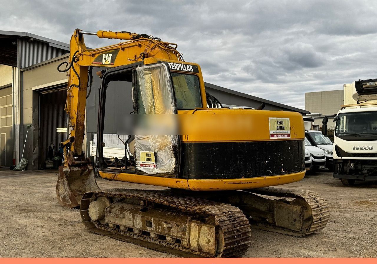 2005 Caterpillar 311C crawler excavator, rear three-quarter view