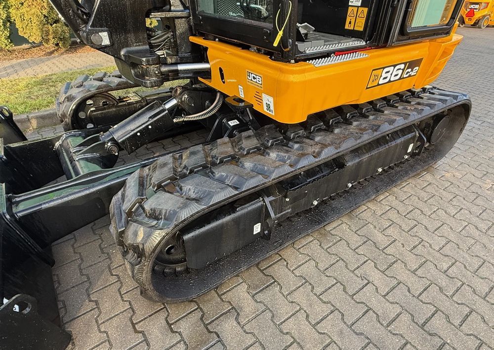 2024 JCB 86C-2 mini excavator side view of tracks and cab 2024 JCB 86C-2 mini excavator side view of tracks and cab