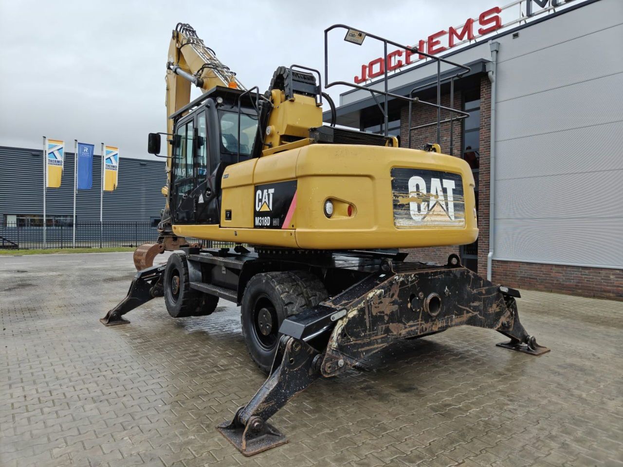 2010 Caterpillar M318D MH demolition excavator rear three-quarter view 2010 Caterpillar M318D MH demolition excavator rear three-quarter view