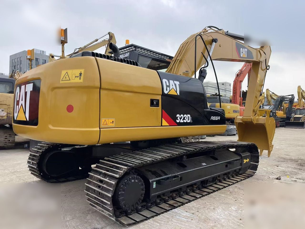 2023 Caterpillar 323DL crawler excavator, rear three-quarter view