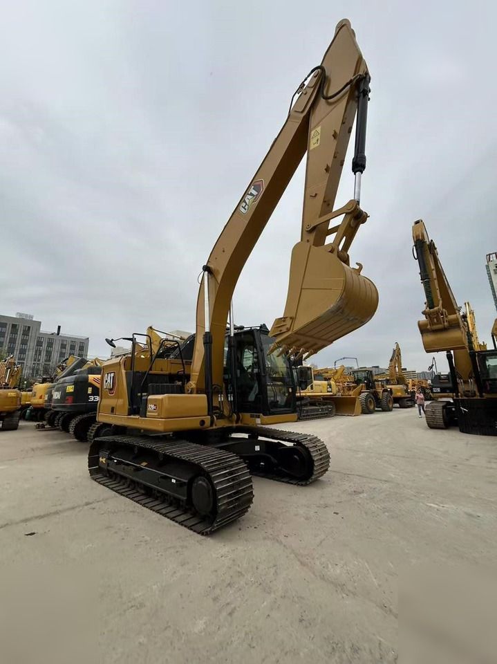 2023 Caterpillar 320GC crawler excavator, front three-quarter view