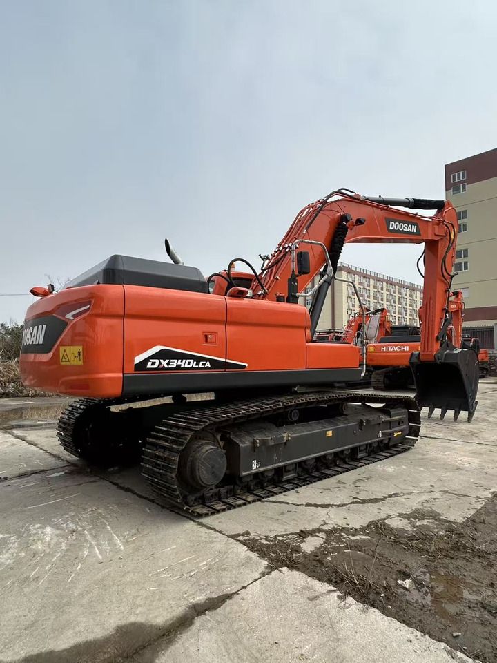 2024 Doosan DX340LCA crawler excavator, rear three-quarter view 2024 Doosan DX340LCA crawler excavator, rear three-quarter view