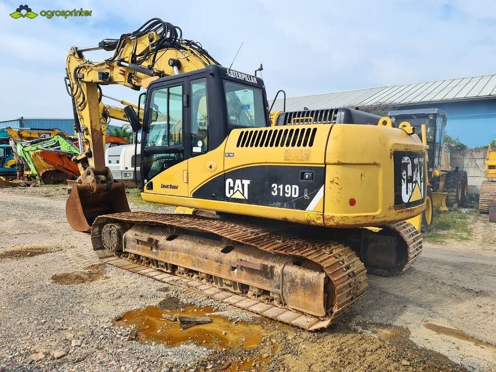 2008 Caterpillar 319DL crawler excavator, rear three-quarter view 2008 Caterpillar 319DL crawler excavator, rear three-quarter view
