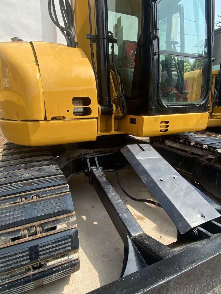 2021 Caterpillar 308C mini excavator side view of cab and tracks 2021 Caterpillar 308C mini excavator side view of cab and tracks
