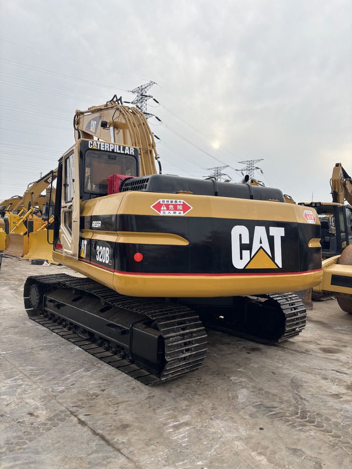 2023 Caterpillar 320BL crawler excavator, rear three-quarter view 2023 Caterpillar 320BL crawler excavator, rear three-quarter view