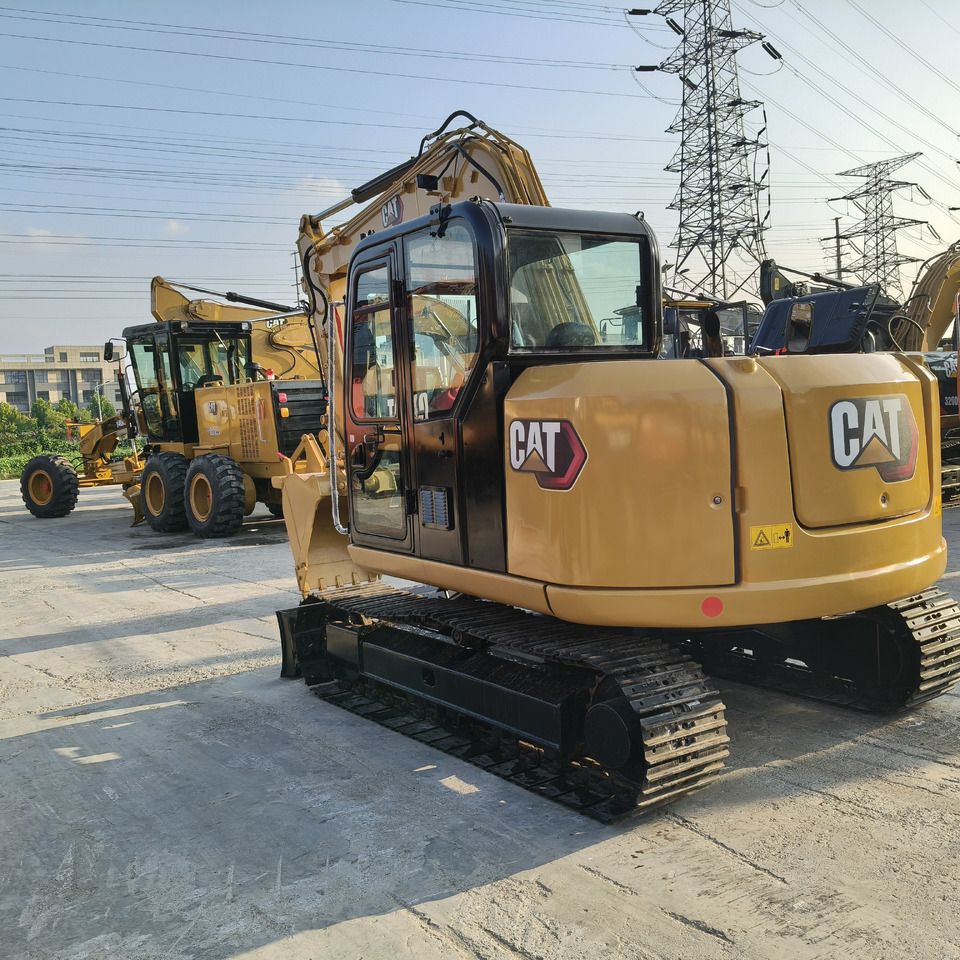 2022 Caterpillar 308E2 mini excavator, rear three-quarter view 2022 Caterpillar 308E2 mini excavator, rear three-quarter view