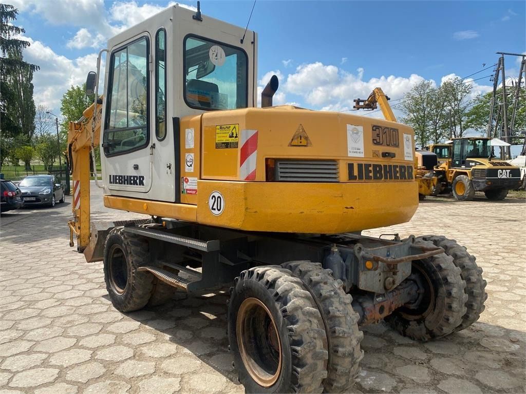 2000 Liebherr A310B wheel excavator, rear three-quarter view 2000 Liebherr A310B wheel excavator, rear three-quarter view