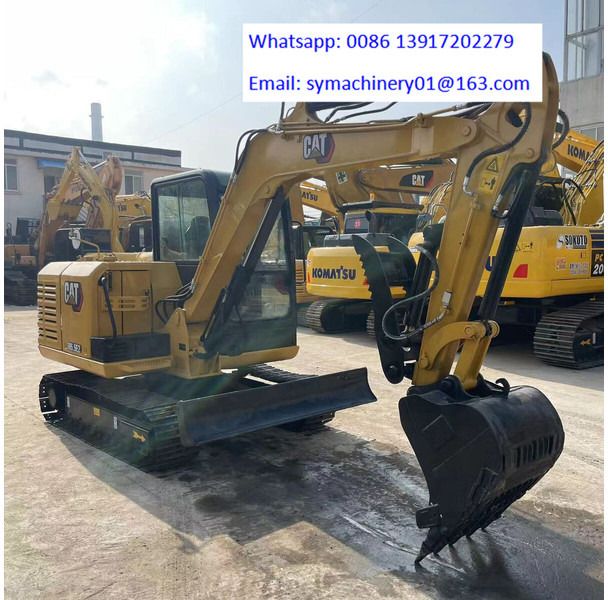 2023 Caterpillar 305.5E2 mini excavator, front three-quarter view
