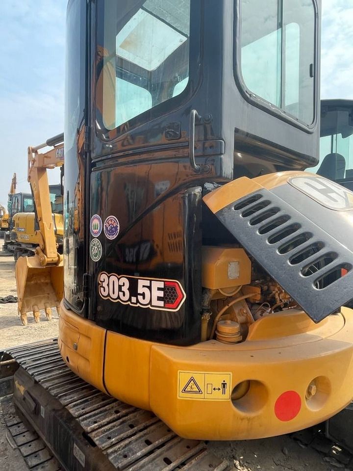 2024 Caterpillar 303.5E mini excavator, close-up of open engine compartment 2024 Caterpillar 303.5E mini excavator, close-up of open engine compartment