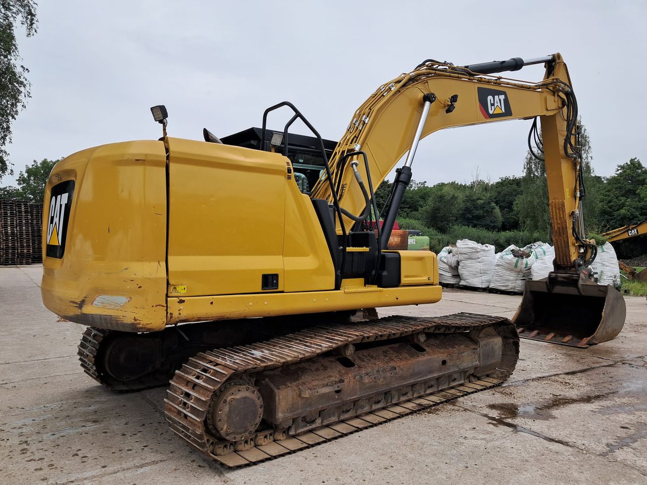 2018 Caterpillar 323GC crawler excavator rear three-quarter view