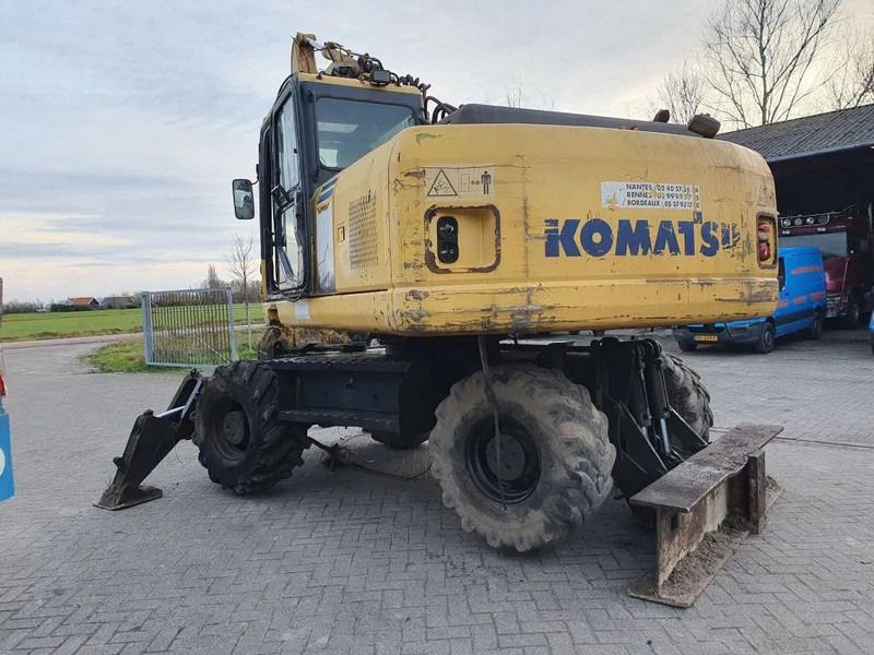 2006 Komatsu PW180-7K wheel excavator rear three-quarter view 2006 Komatsu PW180-7K wheel excavator rear three-quarter view