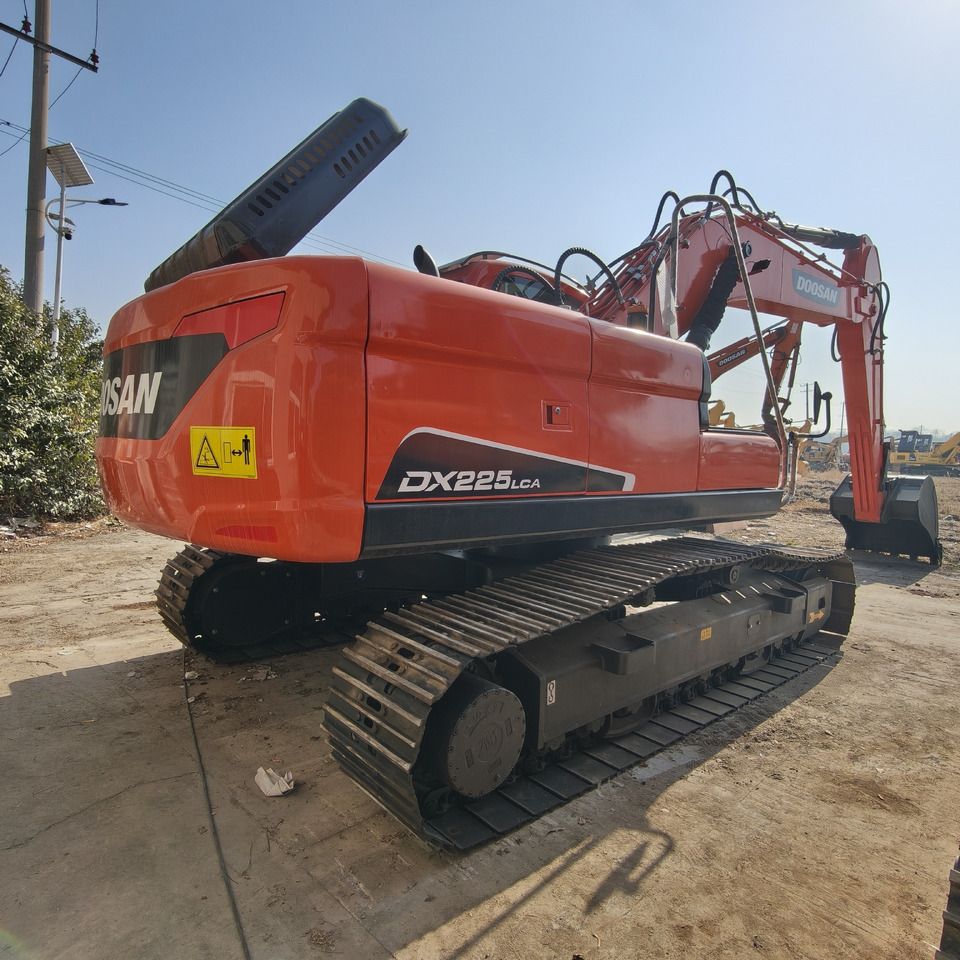 2024 Doosan DX225LCA crawler excavator, rear three-quarter view 2024 Doosan DX225LCA crawler excavator, rear three-quarter view