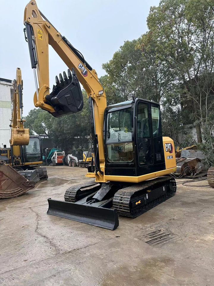 2021 Caterpillar 305.5E2 mini excavator, front three-quarter view