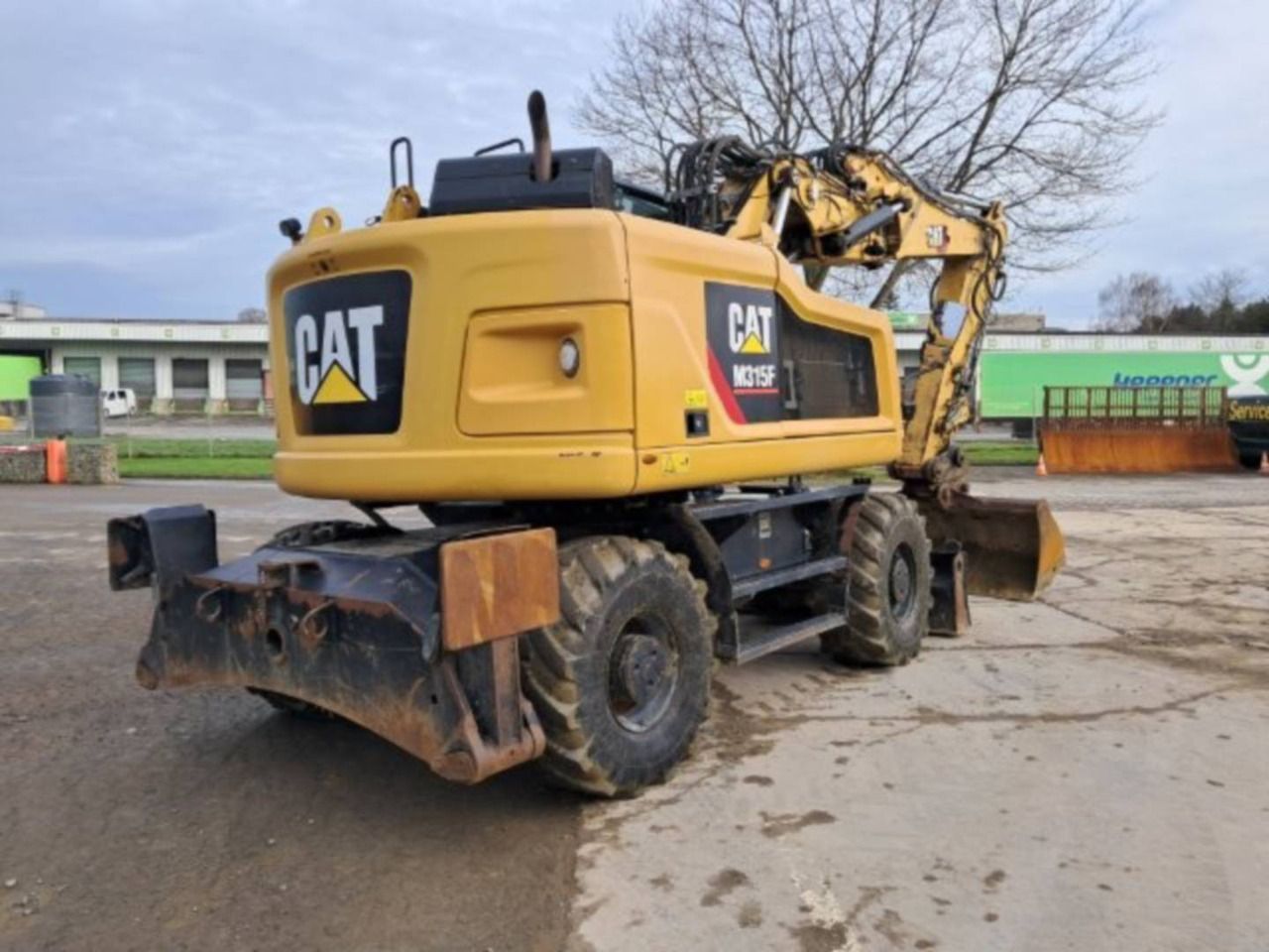 2018 Caterpillar M315F wheel excavator rear three-quarter view 2018 Caterpillar M315F wheel excavator rear three-quarter view