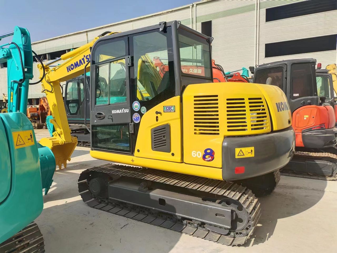 2022 Komatsu PC60-8 mini excavator, rear three-quarter view 2022 Komatsu PC60-8 mini excavator, rear three-quarter view