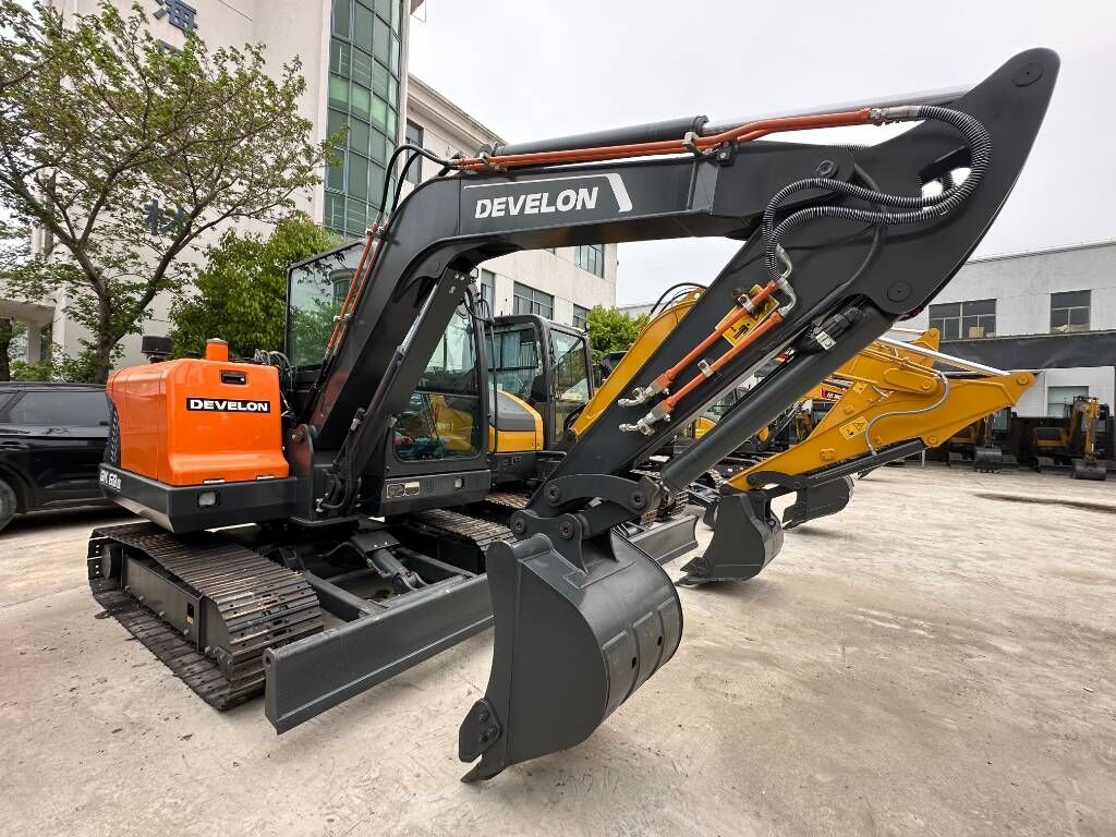 2026 Develon DX60D-10 mini excavator, side view 2026 Develon DX60D-10 mini excavator, side view