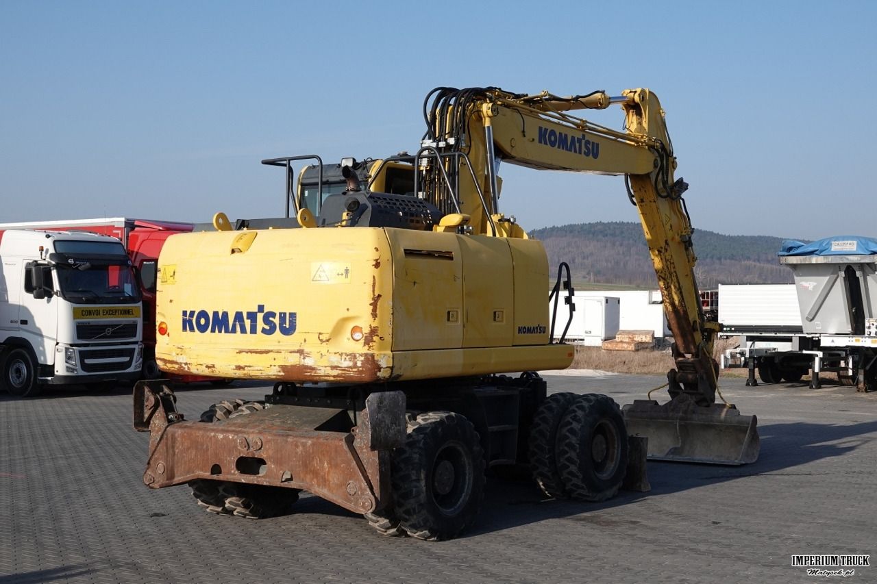 2017 Komatsu PW180-10 wheel excavator, rear three-quarter view 2017 Komatsu PW180-10 wheel excavator, rear three-quarter view