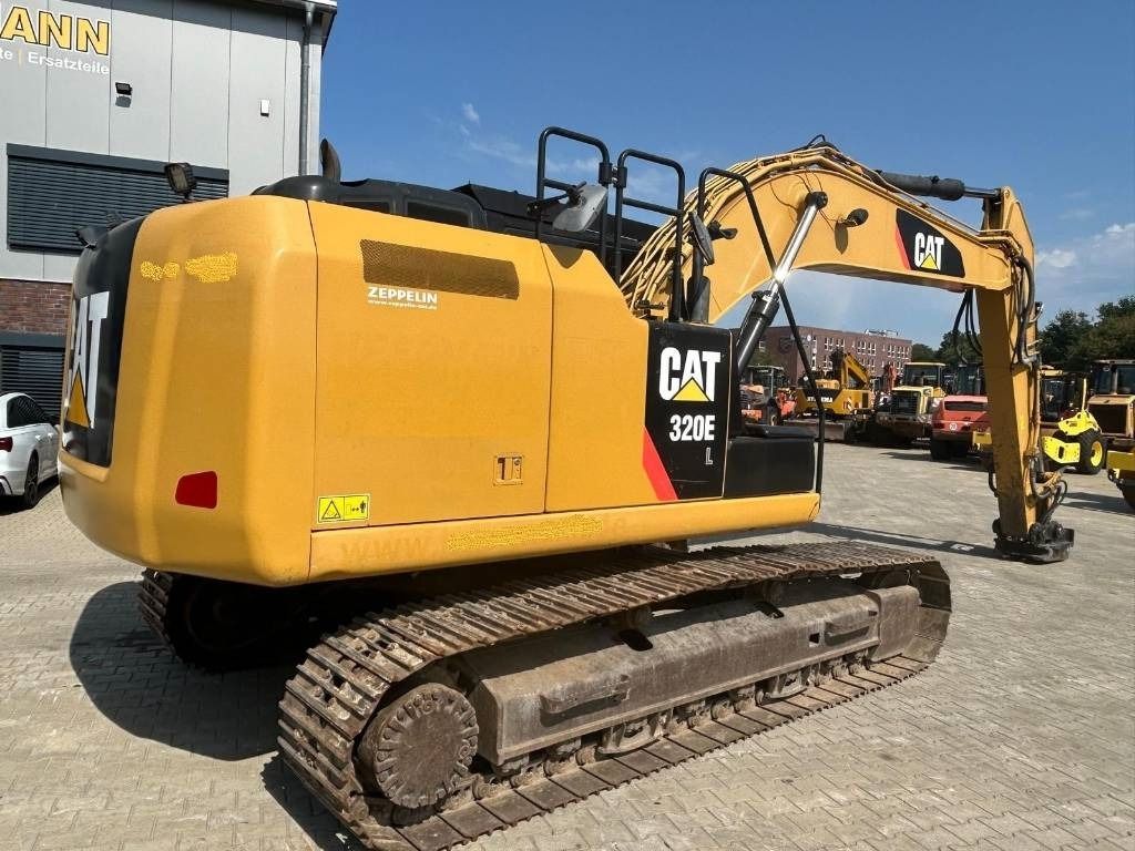 2014 Caterpillar 320EL crawler excavator, rear three-quarter view 2014 Caterpillar 320EL crawler excavator, rear three-quarter view