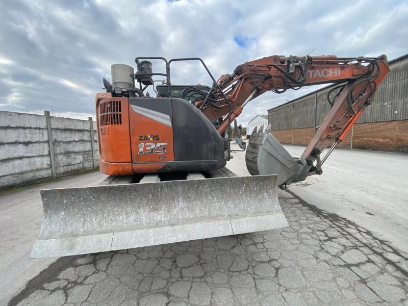 2022 Hitachi Zaxis 135US-7 crawler excavator, rear three-quarter view