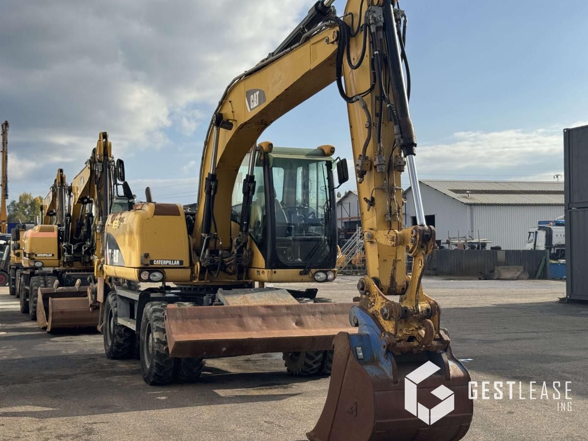 2008 Caterpillar M313D wheel excavator, front three-quarter view 2008 Caterpillar M313D wheel excavator, front three-quarter view