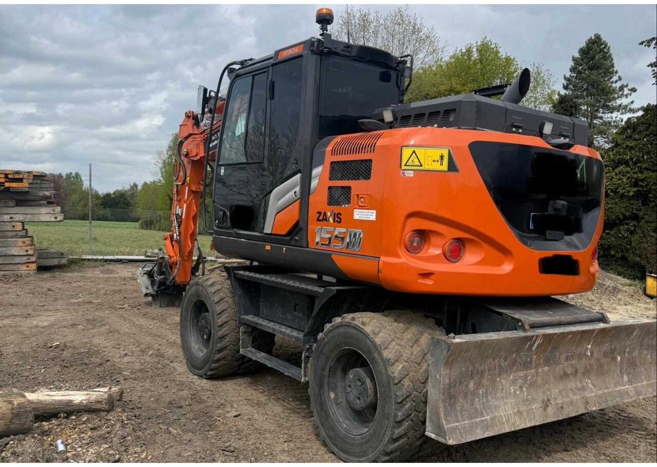 2023 Hitachi Zaxis 155W-7 wheel excavator, rear three-quarter view 2023 Hitachi Zaxis 155W-7 wheel excavator, rear three-quarter view